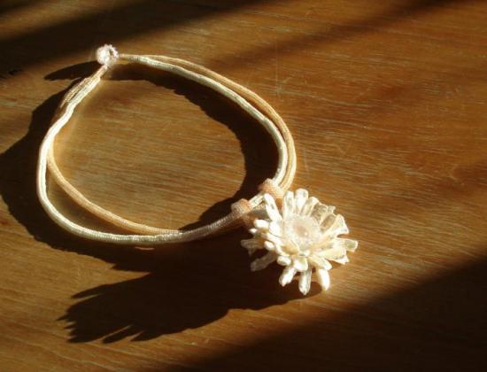Herringbone necklace with pearl flower pendant. 